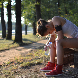 woman rests during a hike